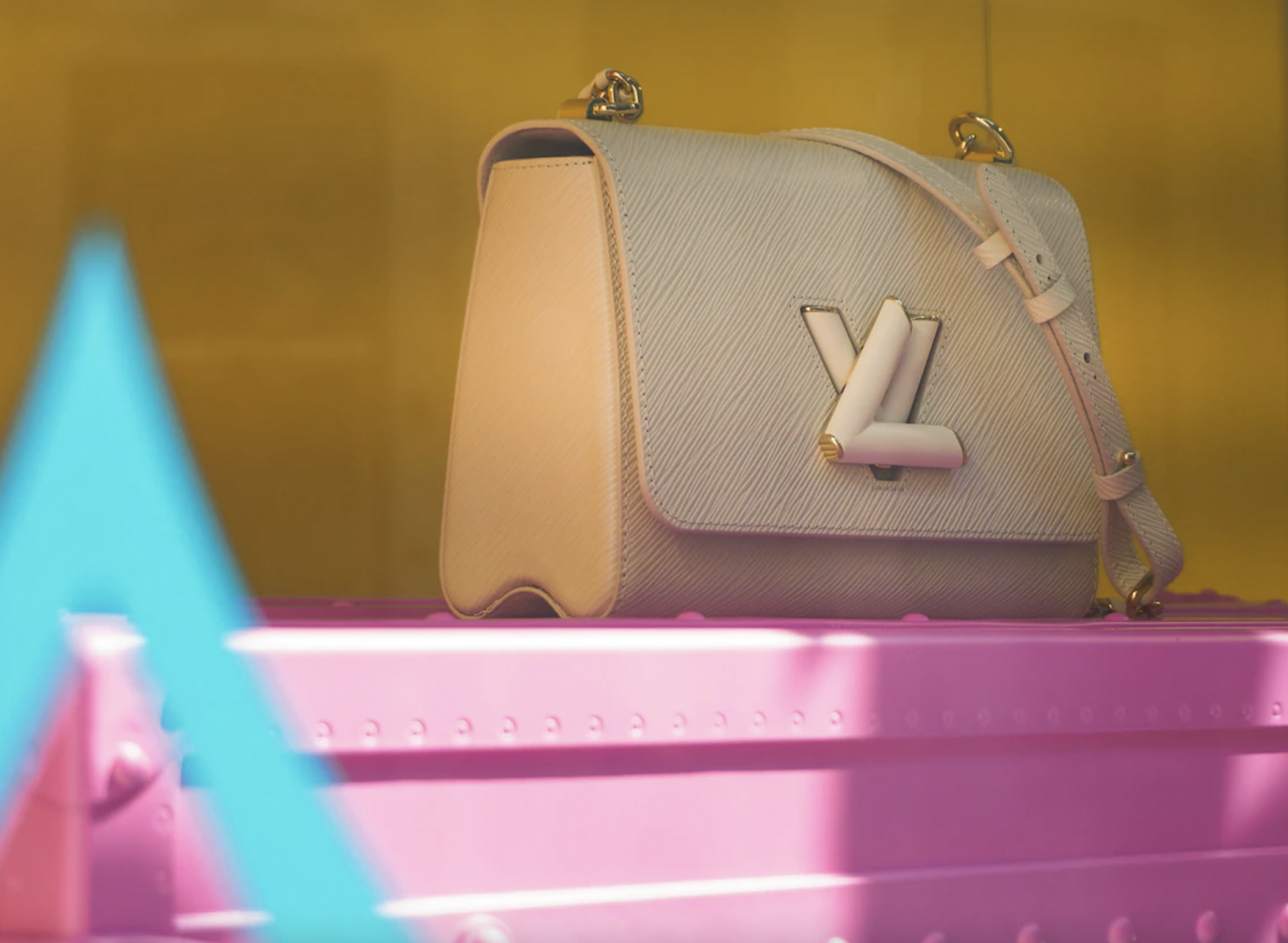 An employee checks a leather bag in the Louis Vuitton workshop in