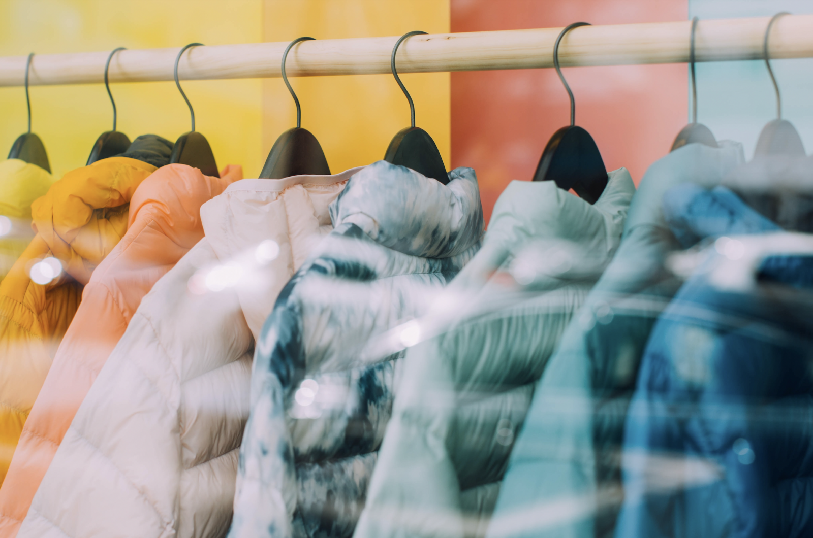 Winter jackets on hangers in a store window