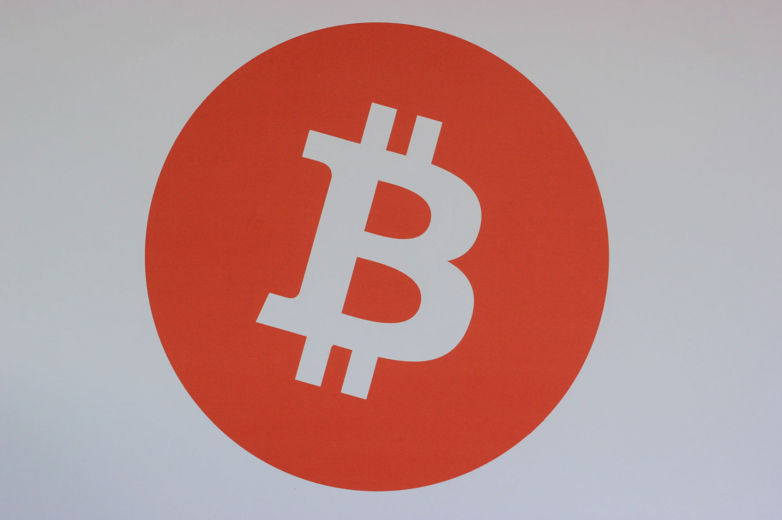 Bitcoin's B logo in a red circle