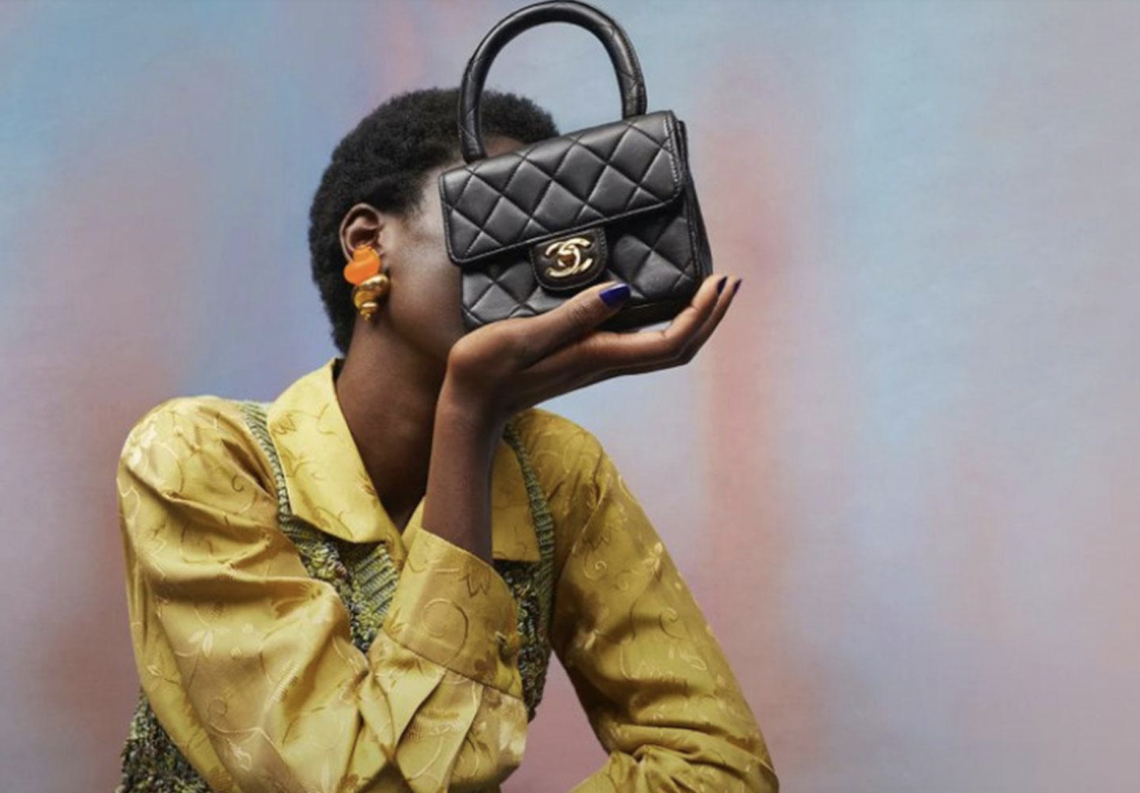 A woman holding a Chanel bag