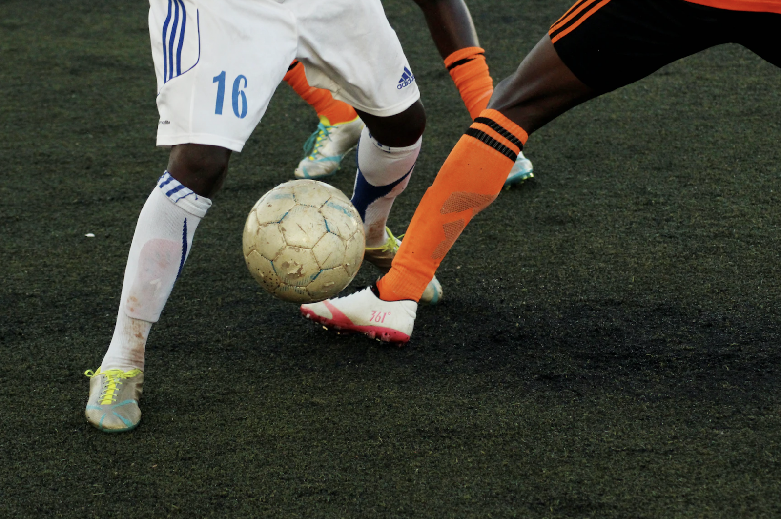 Two men playing soccer
