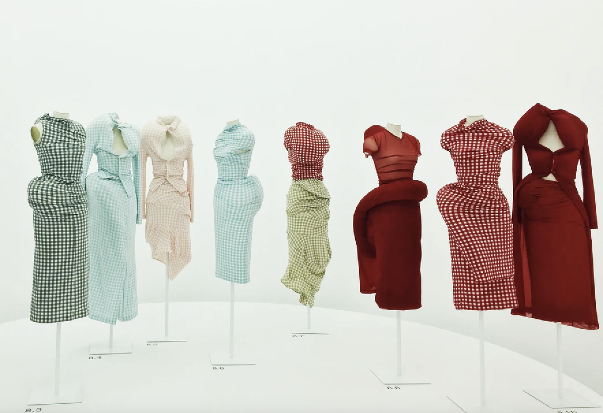 Row of dresses on mannequins