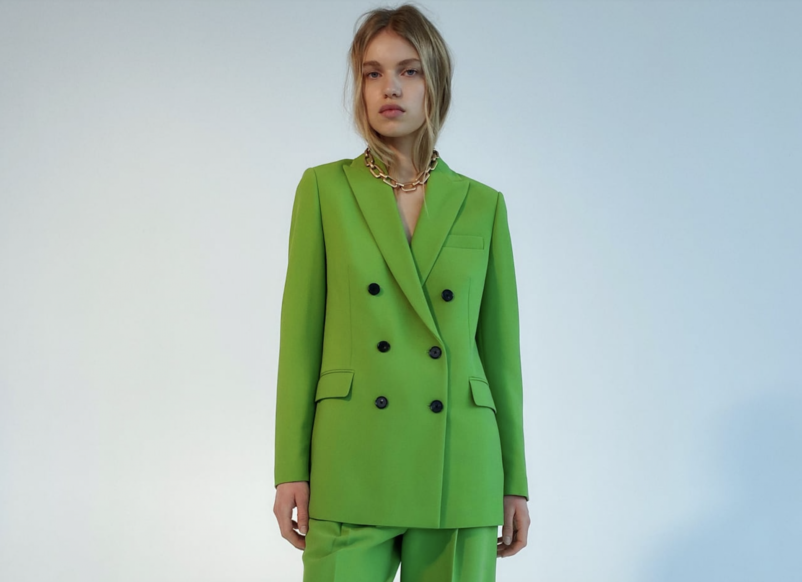 Model wearing green suit from Zara