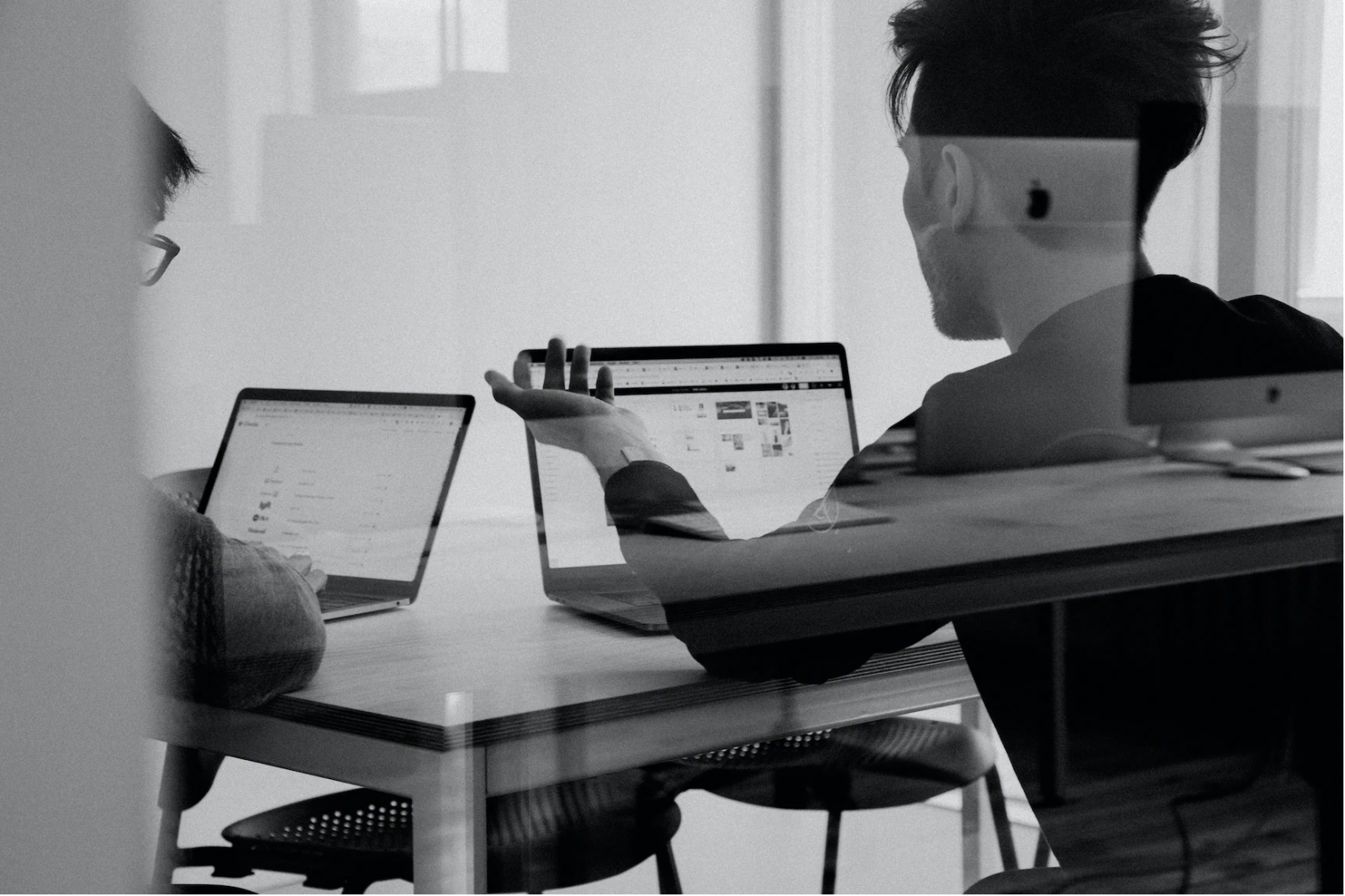 Two men working at computers