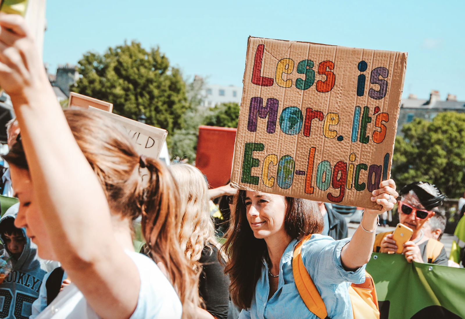 Woman holding a sustainability sign