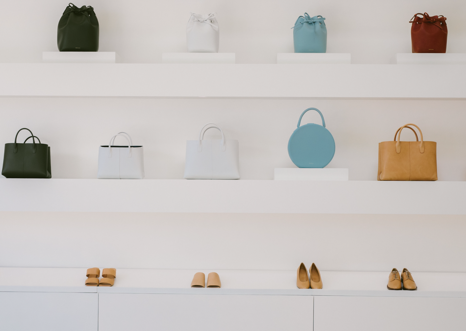 Handbags and shoes in a store shelf