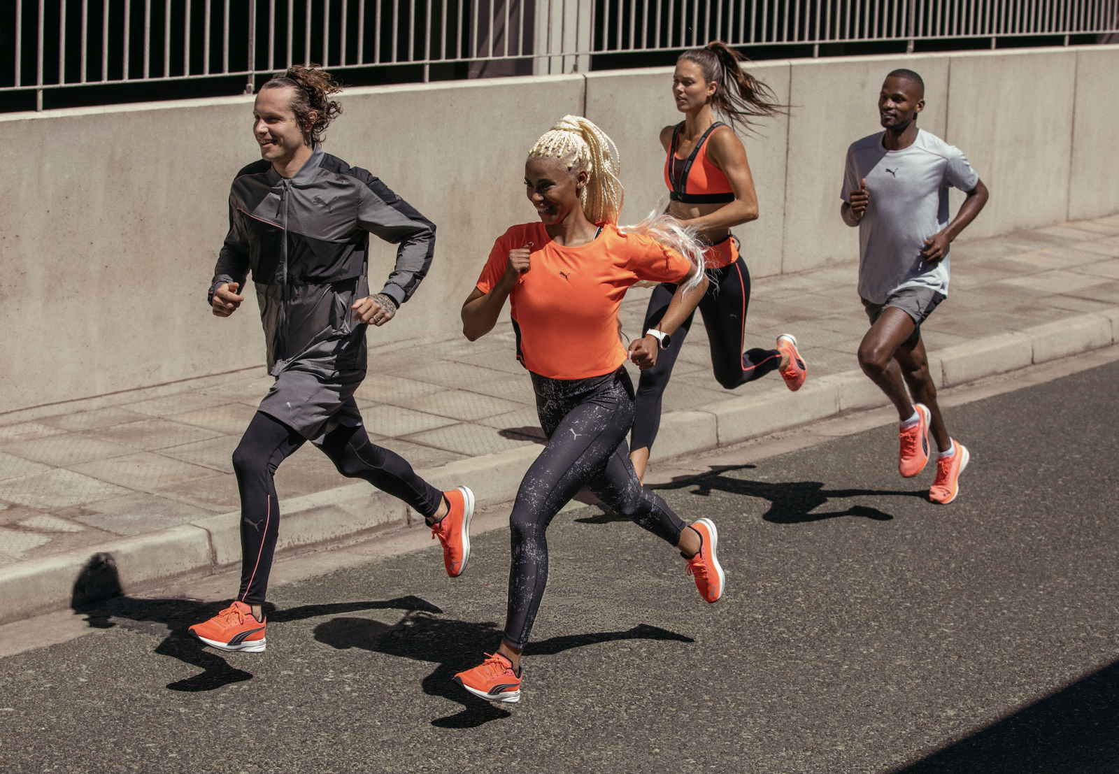 Runners in Puma sneakers