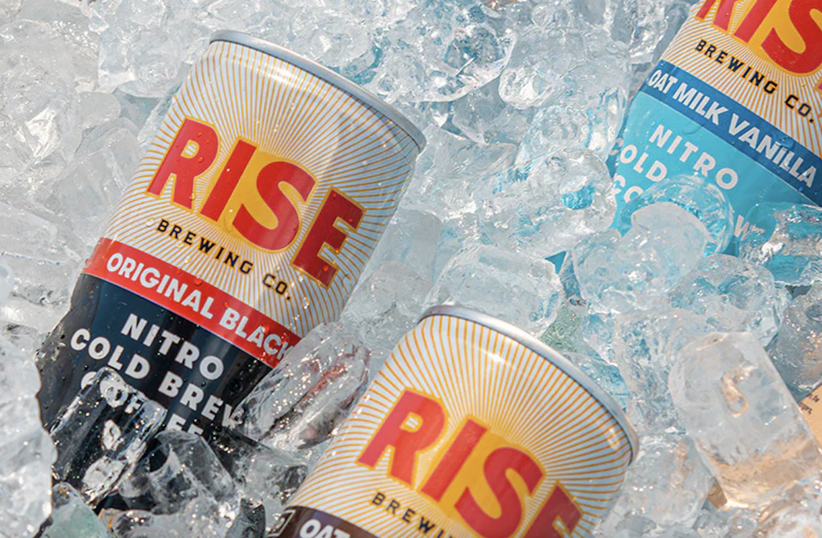 Cans of Rise Brewing coffee in ice