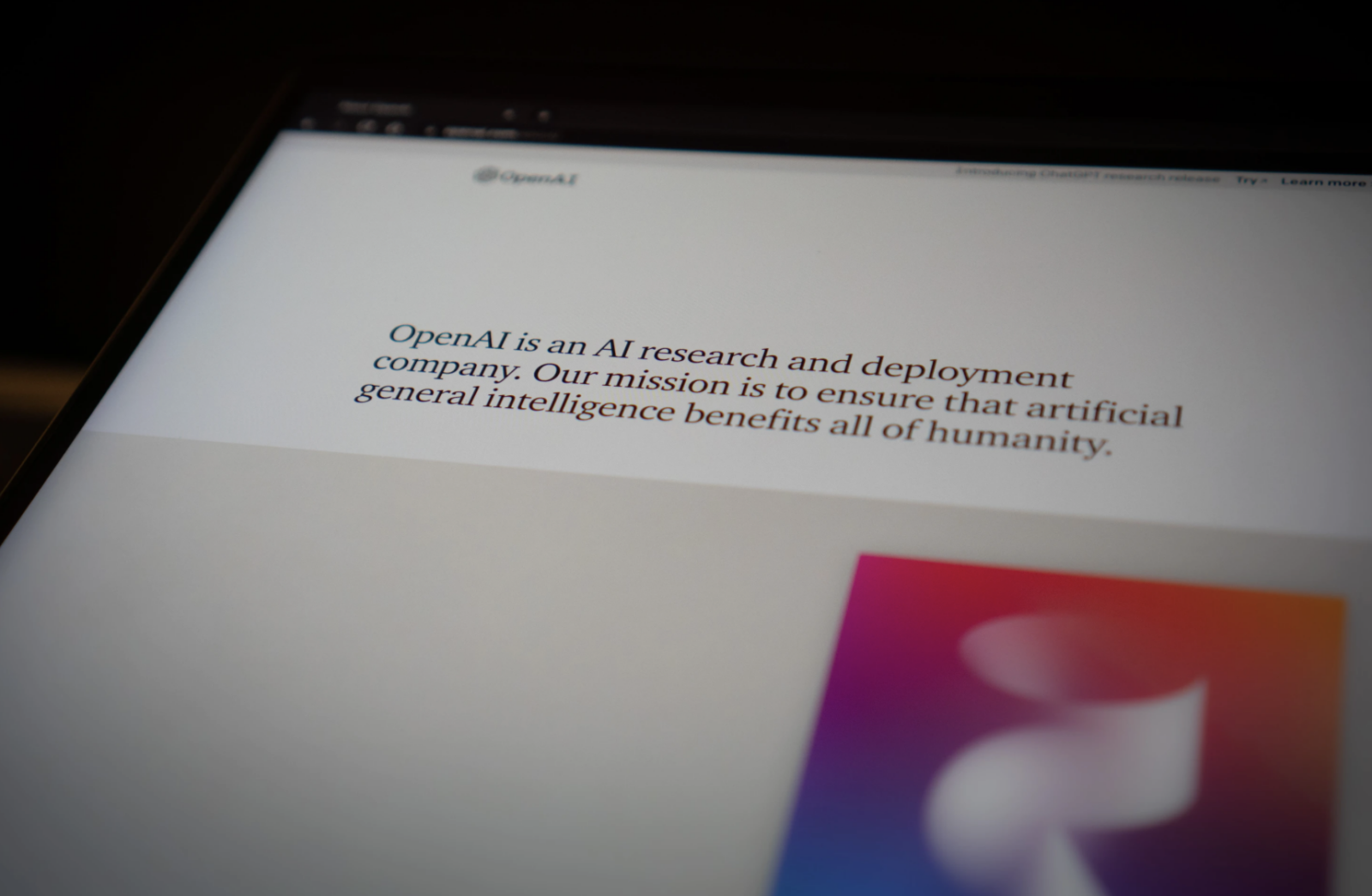 A computer screen showing OpenAI's website